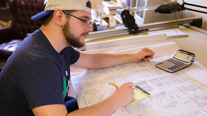 Cody Stone at the drawing table