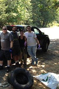 Les, Freddy, Christine, Michael, and Kevin.  Standing in front of a pickup truck full of debris from the Tyee cleanup event.